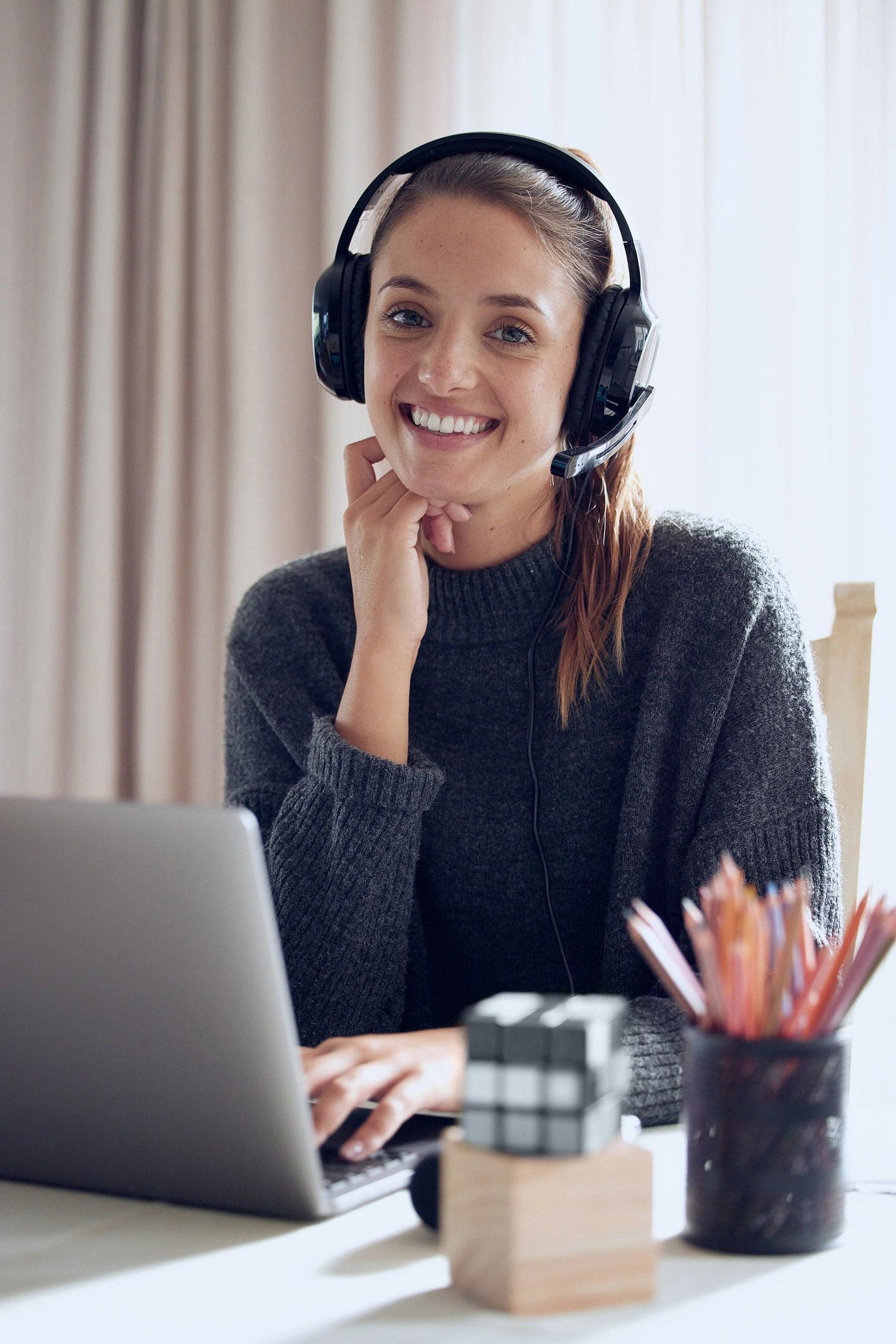 Professional woman teaching or coaching online from a laptop