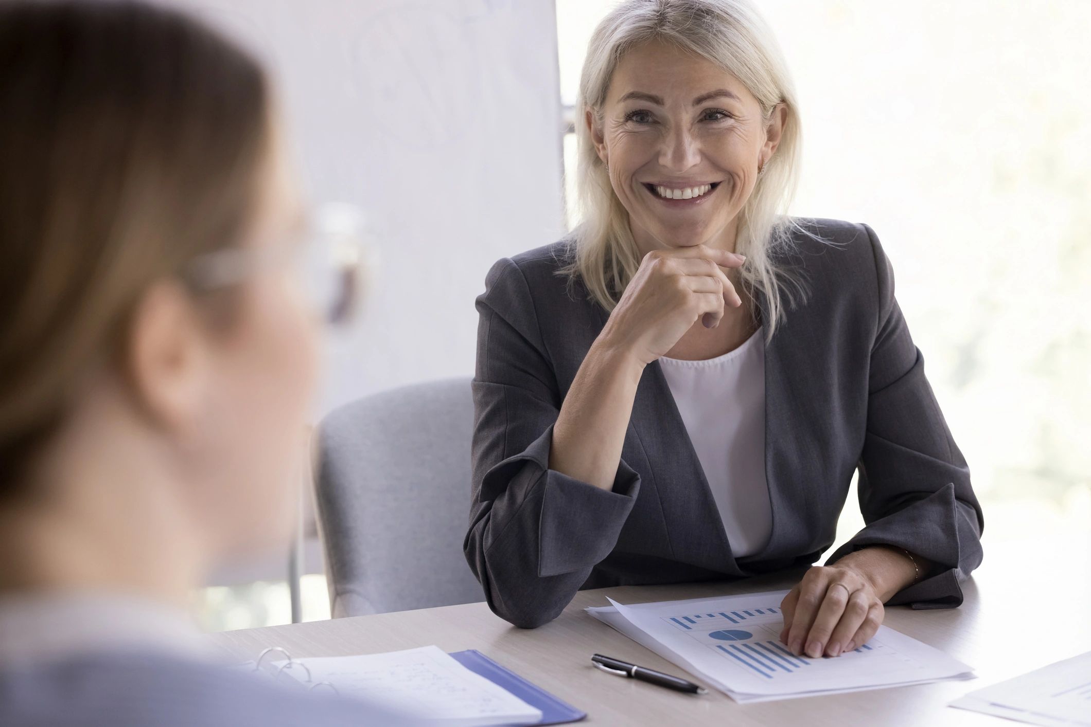 Experienced businesswoman leading a coaching or consulting meeting